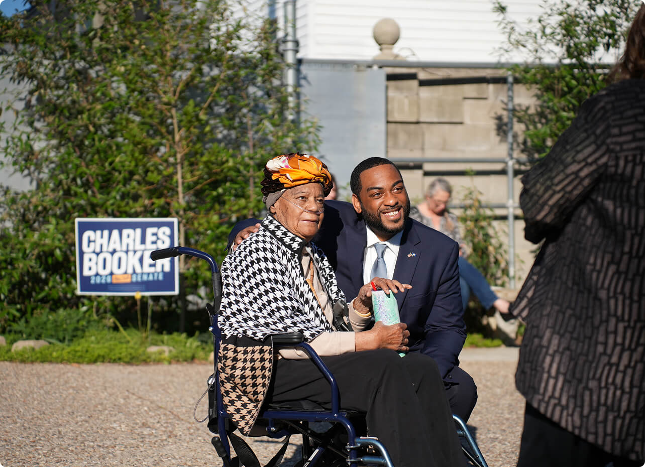 Charles Booker talking with Kentuckians at a community event